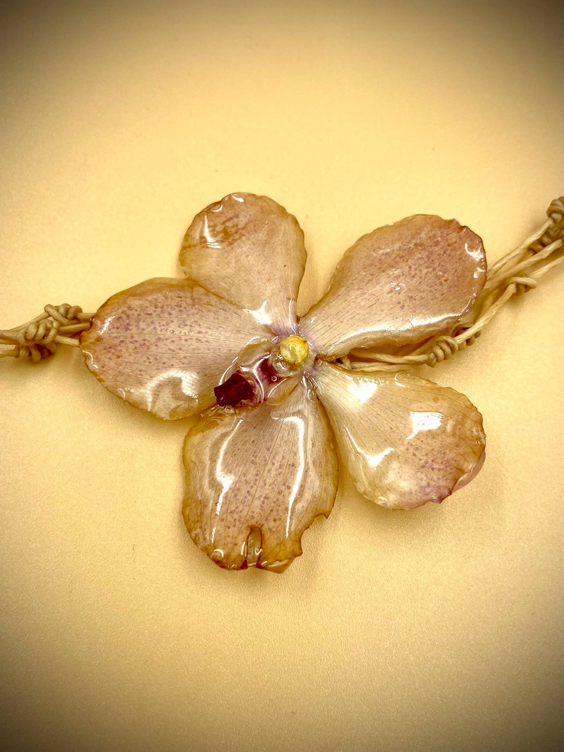 Bracelet made from real flowers, light brown rope