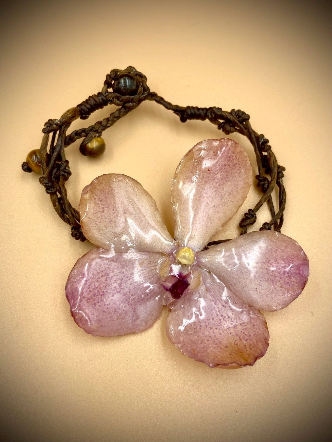 Bracelet made from real orchids, dark brown string