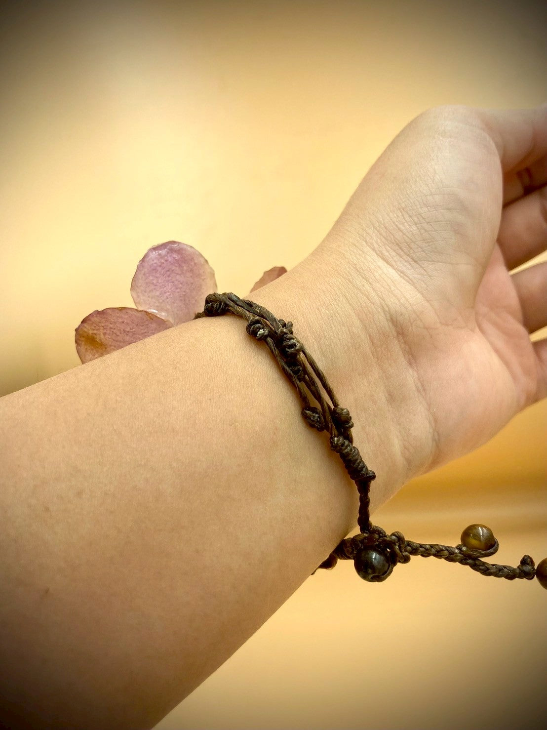 Bracelet made from real orchids, dark brown string