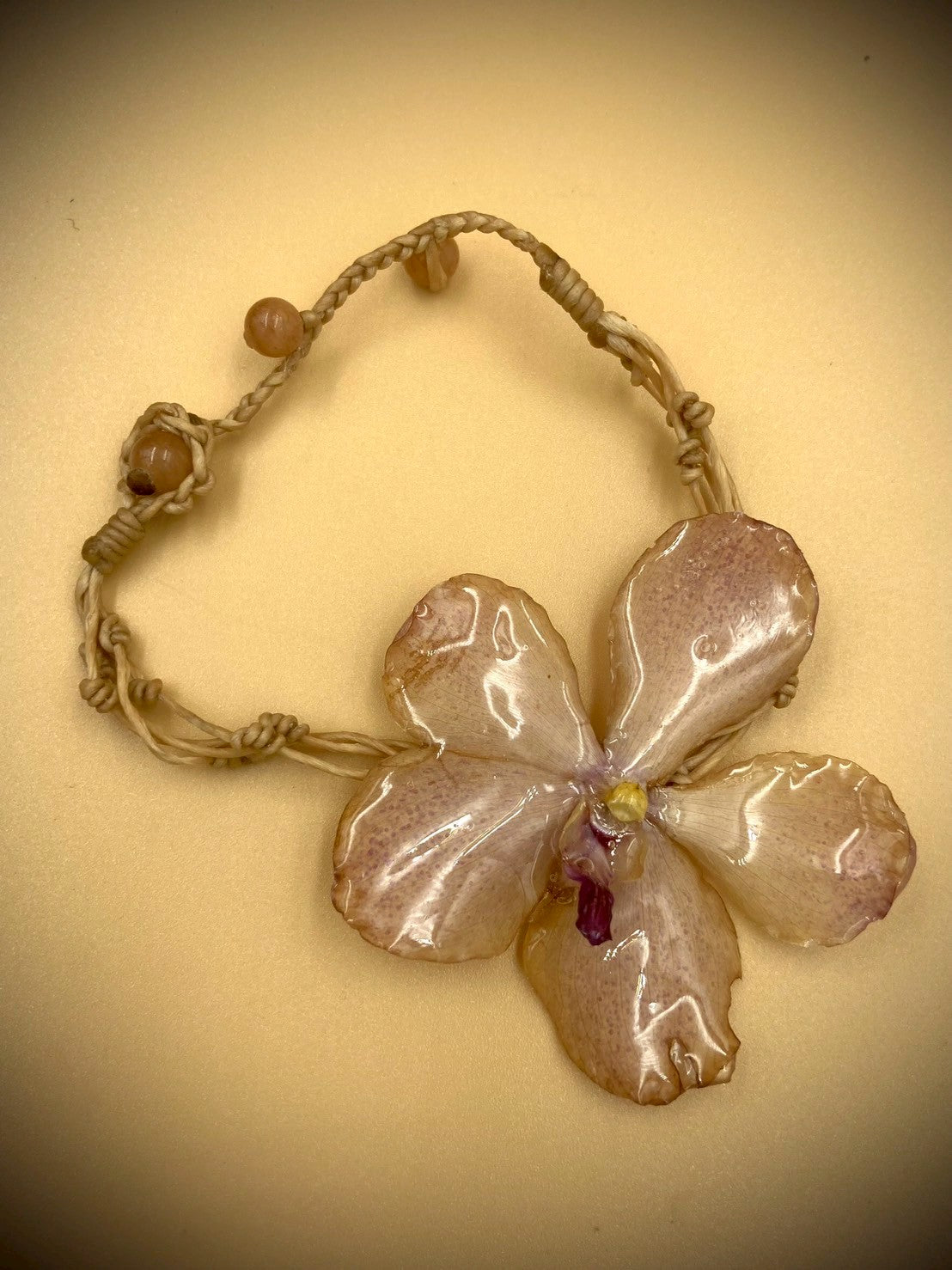 Bracelet made from real flowers, light brown rope