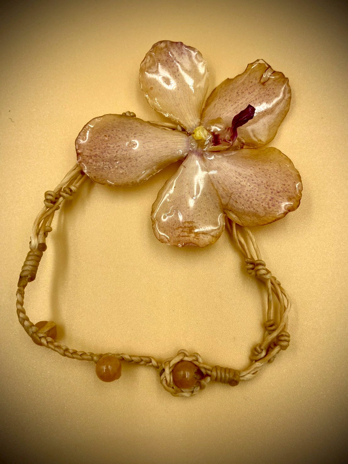 Bracelet made from real flowers, light brown rope