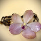 Bracelet made from real orchids, dark brown string